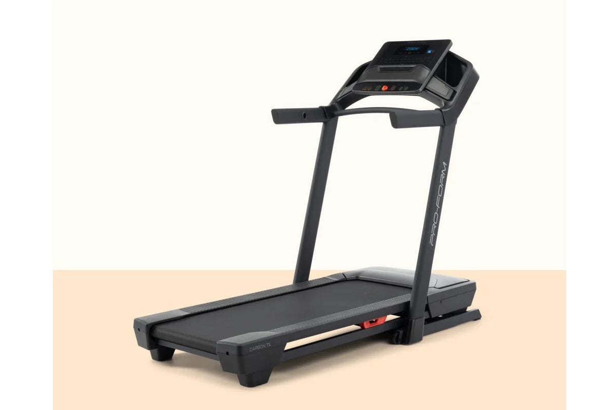 Black ProForm Carbon TLS treadmill with digital display console, dual handrails, and black running belt on beige background