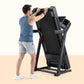 Man using black ProForm treadmill with digital display, wearing blue tank top and gray shorts on beige background
