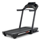 Black ProForm Carbon TLS treadmill with digital console, cushioned running deck, and orange accents on white background