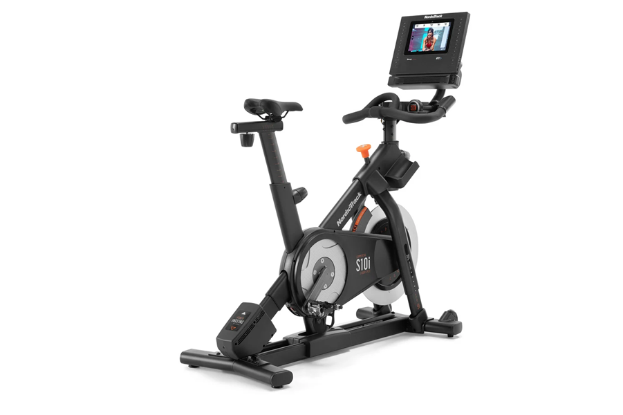 Black and gray NordicTrack S10i stationary exercise bike with adjustable seat, handlebars, and digital display console on whi