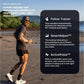 Man jogging on sandy beach wearing black shirt and shorts, with iFIT Pro Membership feature overlay showing Follow Trainer, S