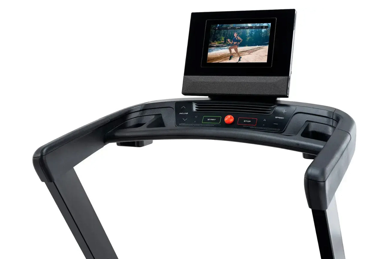 Black treadmill console with integrated tablet mount displaying workout video, control buttons including start and stop, on w
