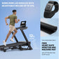 Man running on black NordicTrack treadmill with incline display, wearing olive shirt and beige shorts, with heart rate monito