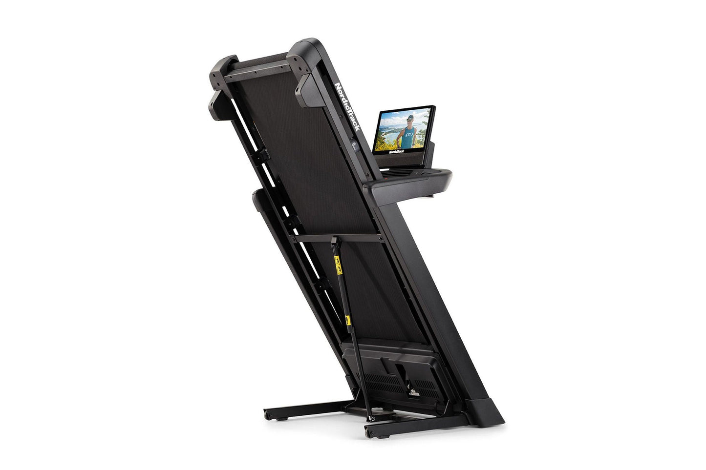Black folding treadmill with attached tablet holder displaying workout video, angled view on white background