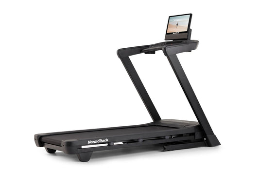NordicTrack T-Series 16 treadmill with black frame, running deck, and attached digital display console showing beach scene on