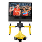 NordicTrack Tour De France indoor exercise bike with yellow frame and handlebars, black seat, and display screen showing fitn