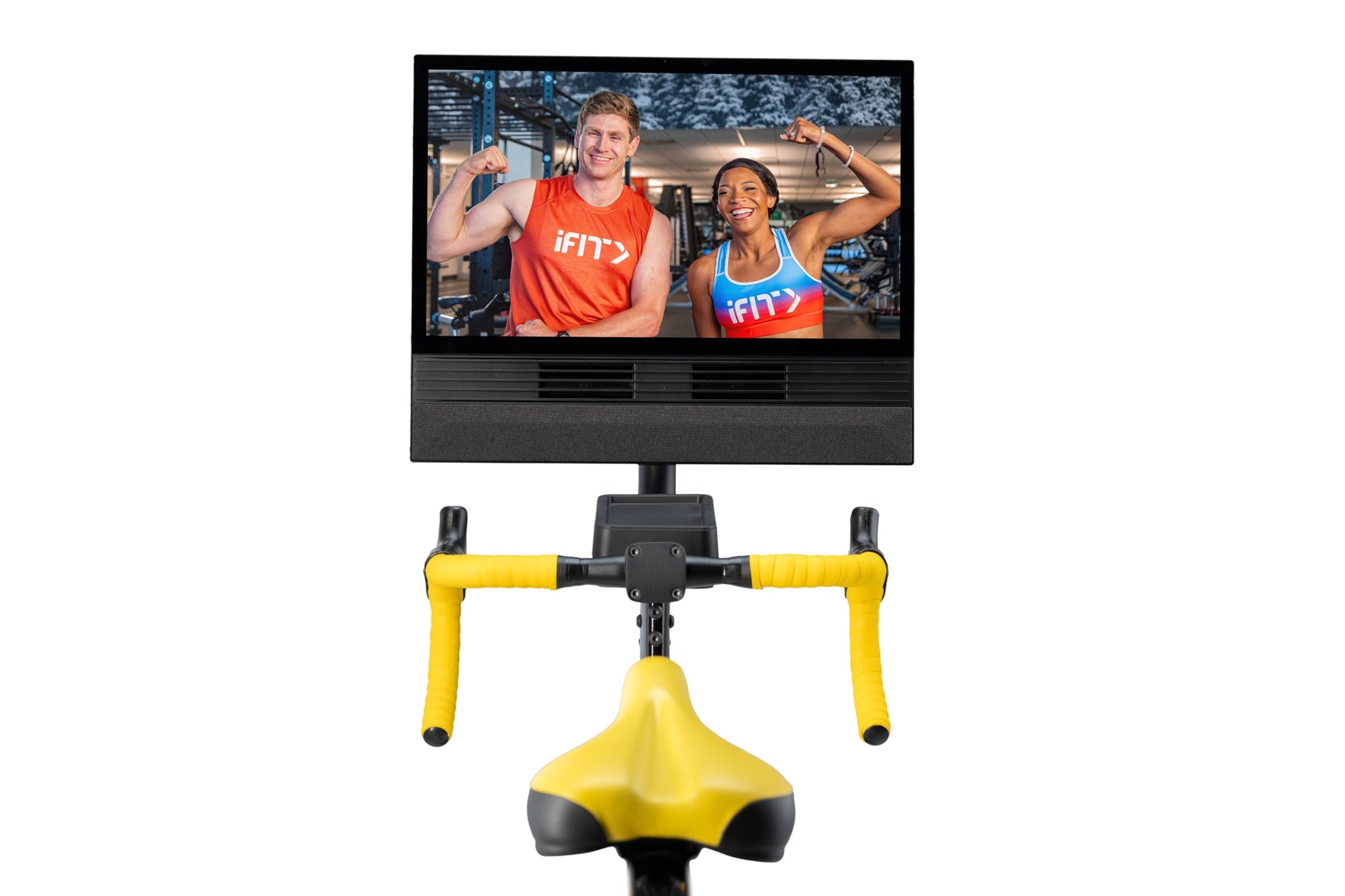 NordicTrack Tour De France indoor exercise bike with yellow frame and handlebars, black seat, and display screen showing fitn