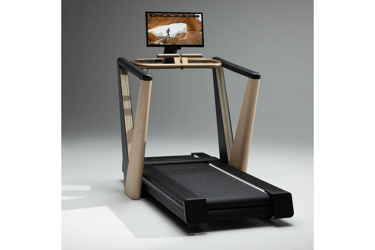 NordicTrack Ultra 1 treadmill with black running belt, tan and black frame, touchscreen display showing outdoor running scene