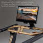 Exercise bike with gold and black handlebars displaying workout video on 24-inch HD screen mounted above