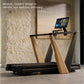 Modern treadmill with black running belt, natural wood and black frame, tablet holder displaying fitness content, in contempo