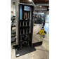 Black NordicTrack Vault home gym mirror with open door displaying stored weights, resistance bands, and workout accessories i
