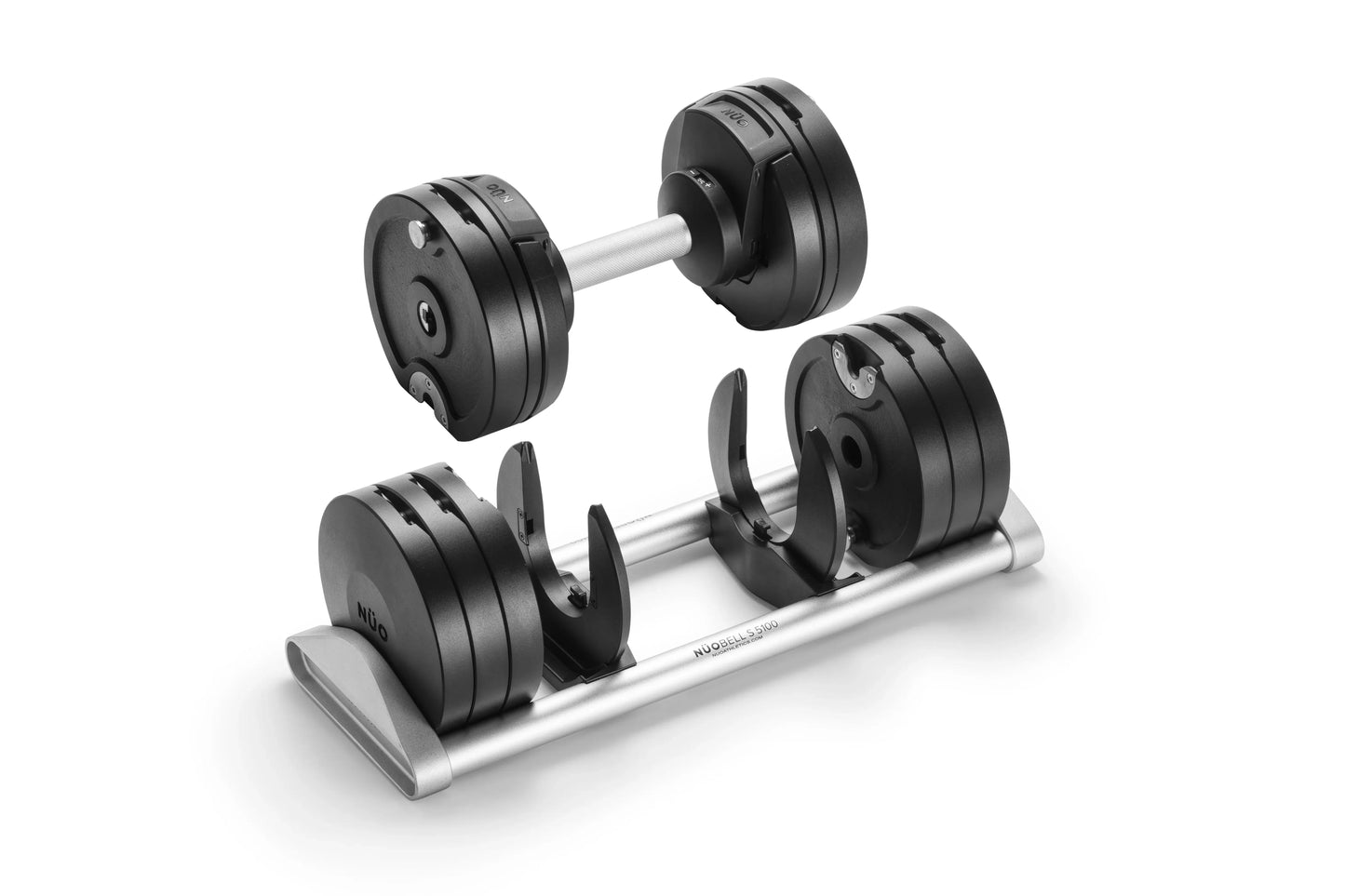 Pair of black adjustable dumbbells with silver handles on matching storage tray, shown on white background