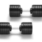 Pair of black adjustable dumbbells with segmented weight plates and gray handles, shown in two angles on white background