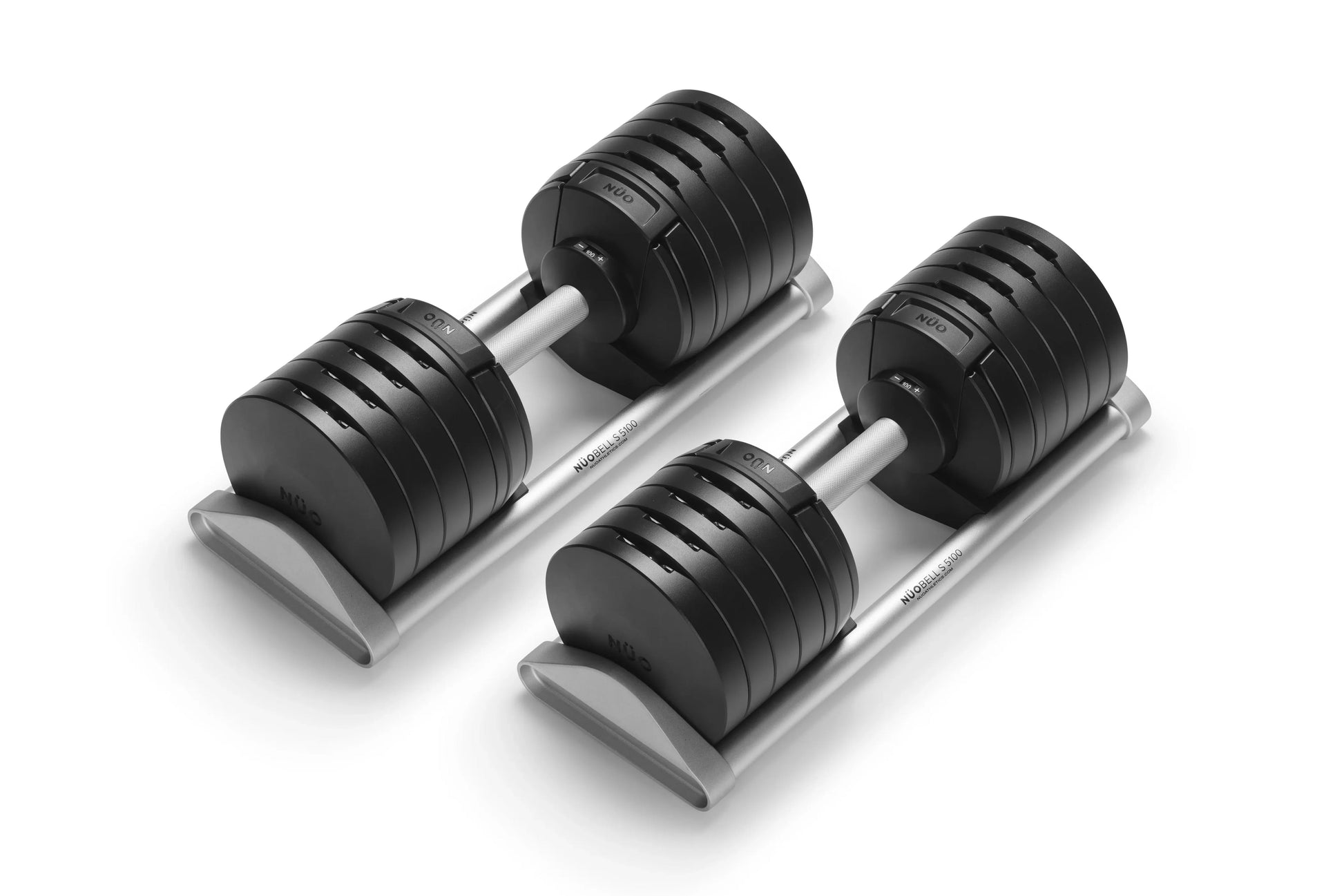 Pair of black adjustable dumbbells with silver handles on gray trapezoidal base, shown on white background