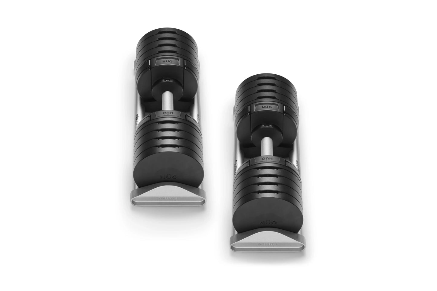 Pair of black adjustable dumbbells with ribbed grip handles and weight selector dials on white background