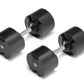 Pair of black adjustable dumbbells with chrome handles and weight plates labeled NÜOBELL, displayed on white background