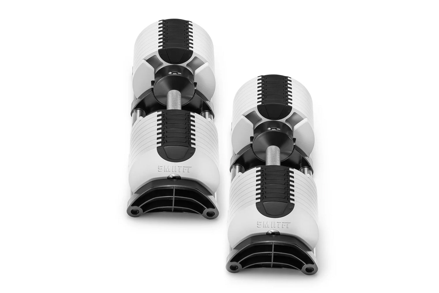 Pair of NÜOBELL adjustable dumbbells in white and black, flat lay on white background