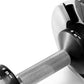 Pair of black and gray adjustable dumbbells with textured grip handles, weight markings visible on ends, flat lay on white ba