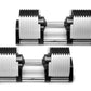 Pair of adjustable dumbbells with white and black segmented plates, silver metal handles, and black end caps on white backgro