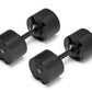 Pair of matte black adjustable dumbbells with black handle and textured weight plates, marked with weight indicator on white 