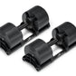 Pair of matte black Nüobell adjustable dumbbells with textured weight plates and black handles on white background