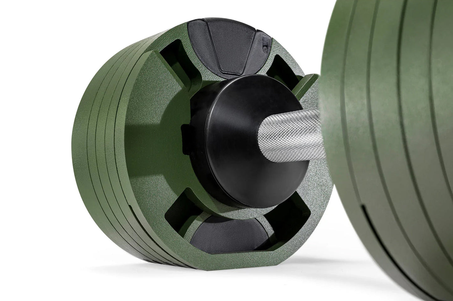 Nüobell 80lb adjustable dumbbells in sage green with black metal core and white grip handle, shown in flat lay on white backg