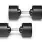 Pair of black adjustable dumbbells with ribbed rubber heads and gray metal handles on white background