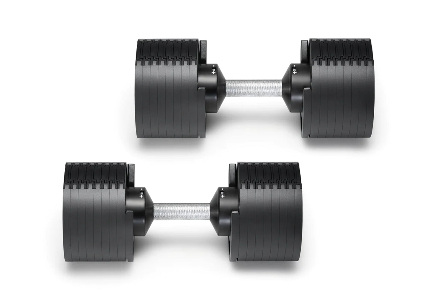 Pair of black adjustable dumbbells with ribbed rubber heads and gray metal handles on white background