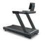 Octane OC100 black treadmill with angled frame, 10-inch touchscreen console mounted on top, on white background