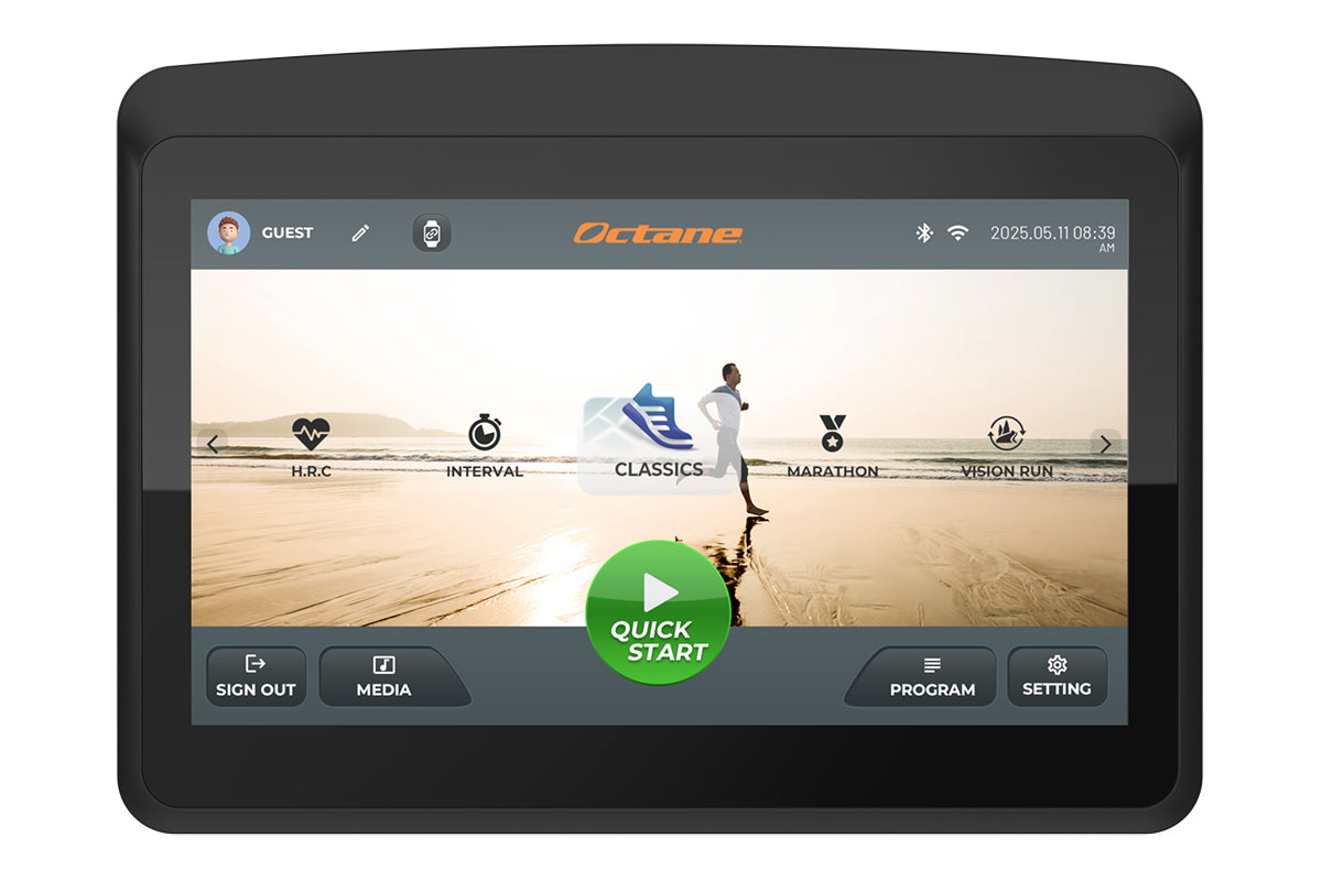 Black tablet displaying Octane fitness app interface with beach running scene, workout program icons, and quick start button