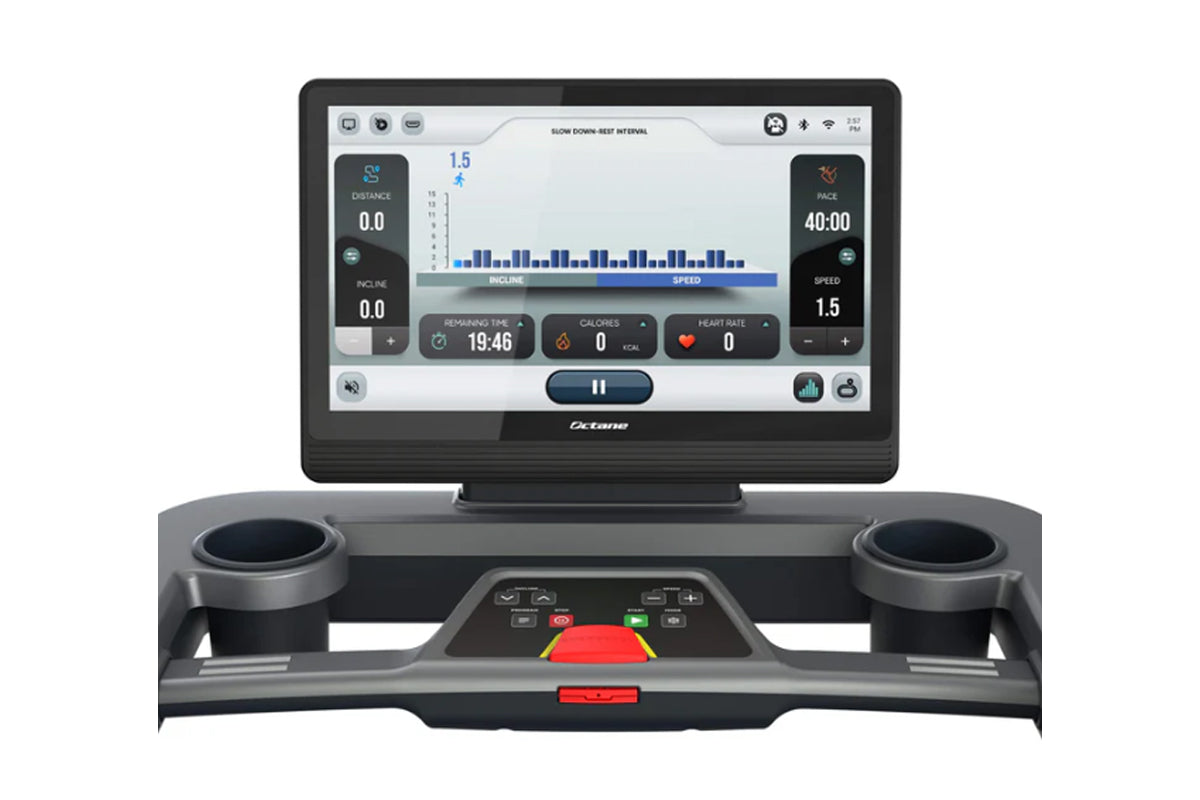 Octane OC220 treadmill with black frame, dual cup holders, and touchscreen display showing workout metrics including distance