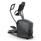 Black and gray home elliptical machine with padded seat, dual handles, foot pedals, and digital display console on white back
