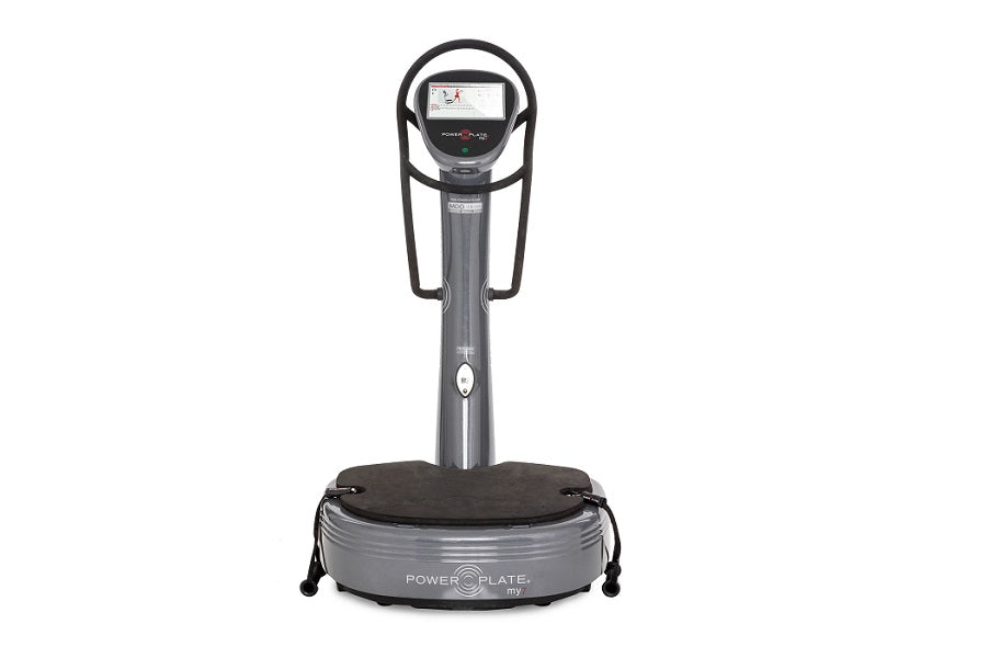 Power Plate My7 vibration plate trainer with gray base, vertical column, black handles, and digital display screen on white b
