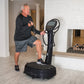 Man using black Power Plate My7 vibration plate trainer with digital display in home gym setting