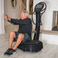 Man using black Power Plate My8 vibration plate trainer with digital display in home gym setting