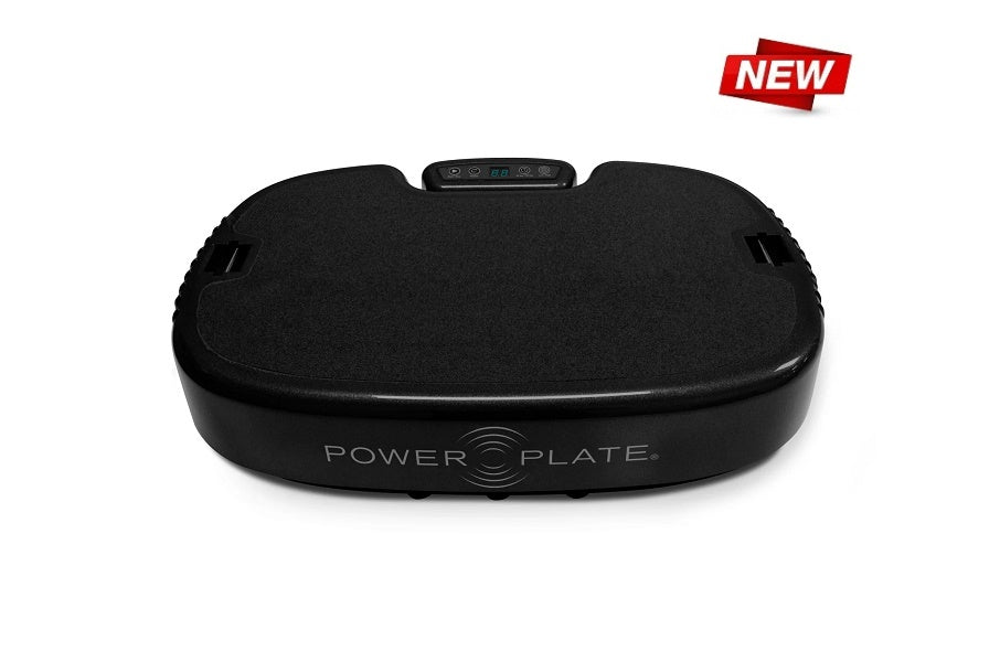 Black Power Plate vibration machine with curved platform, control panel on top, and side handles on white background