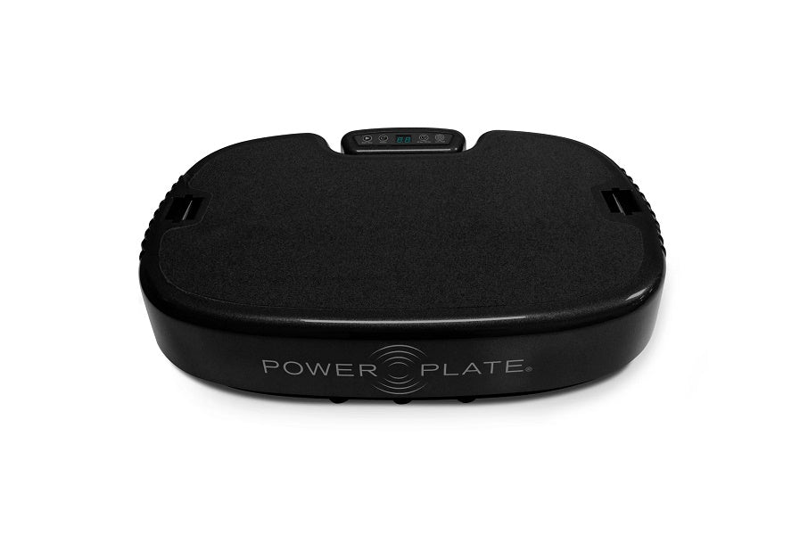 Black Power Plate vibration machine with textured surface and control panel on white background
