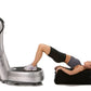 Silver Power Plate vibration platform with black handle bar, woman using machine in black and purple workout clothes on white