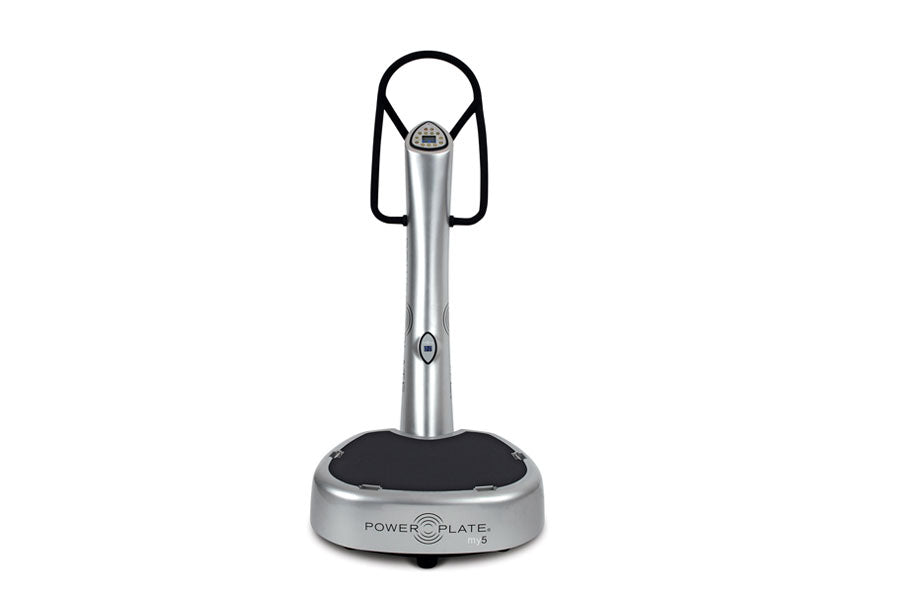 Power Plate My5 vibration trainer with silver metal column, black handles, and circular base on white background