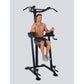 Black multi-function power tower with pull-up bar and leg raise station, demonstrated by shirtless male model on gray backgro