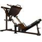 Black and bronze leg press machine with padded seat and foot platform on white background