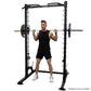 Black power rack with linear bearing smith machine system, man in black tank top and shorts performing barbell squat, white b