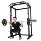 Black power rack with integrated pull-up bar and safety arms, shown with male model demonstrating squat position with loaded 