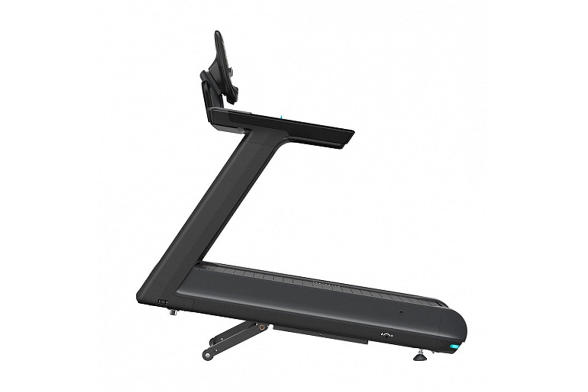 Black motorized treadmill with digital console and adjustable incline on white background