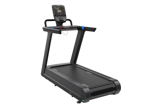 Black motorized treadmill with digital console display, handrails with blue and red handles, and wide running deck on white b