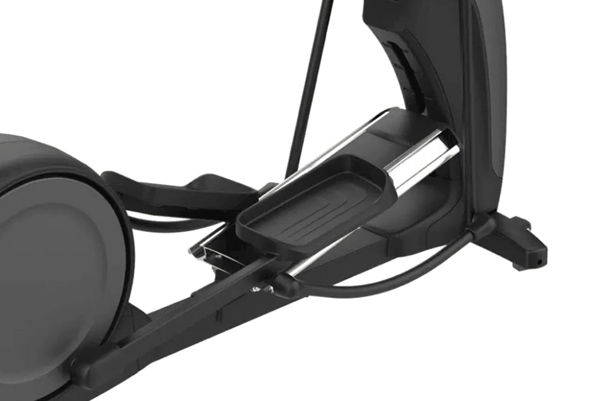 Black elliptical machine with chrome accents and foot pedals, shown at an angle on white background
