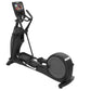 Black elliptical machine with digital touchscreen console, foot pedals, and handles, on white background