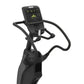 Black elliptical machine with digital console display showing workout metrics and controls, on white background