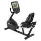 Black recumbent exercise bike with digital console display showing workout metrics, adjustable backrest and seat, on white ba