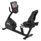 Black recumbent exercise bike with digital console displaying workout metrics, featuring a padded seat with backrest and foot